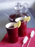 Two Beakers of Fruit Tea with Lemon Wedges, Sugar Sticks-Anita Oberhauser-Photographic Print