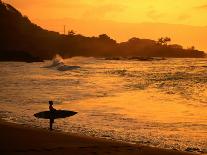 Surfer Standing at Waimea Bay at Sunset, Waimea, U.S.A.-Ann Cecil-Photographic Print