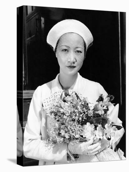 Anna May Wong Arriving in Hollywood in a Travelling Costume of White Herringbone Linen-null-Stretched Canvas