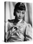 Anna May Wong, in an Orange Nanking Brocade Robe with Sandalwood Fastenings, 1937-null-Stretched Canvas