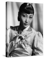 Anna May Wong, in an Orange Nanking Brocade Robe with Sandalwood Fastenings, 1937-null-Stretched Canvas