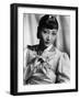 Anna May Wong, in an Orange Nanking Brocade Robe with Sandalwood Fastenings, 1937-null-Framed Photo