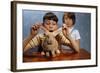 Annoying Brother Playing with His Sister's Pet Rabbit-William P. Gottlieb-Framed Photographic Print