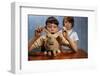 Annoying Brother Playing with His Sister's Pet Rabbit-William P. Gottlieb-Framed Photographic Print