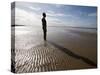 Another Place Sculpture by Antony Gormley on the Beach at Crosby, Liverpool, England, UK-Martin Child-Stretched Canvas