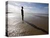 Another Place Sculpture by Antony Gormley on the Beach at Crosby, Liverpool, England, UK-Martin Child-Stretched Canvas