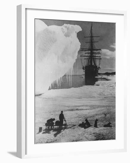 Antarctic Expedition of Robert Scott on Ice with Ship "Terra Nova" Anchored in Background-null-Framed Photographic Print