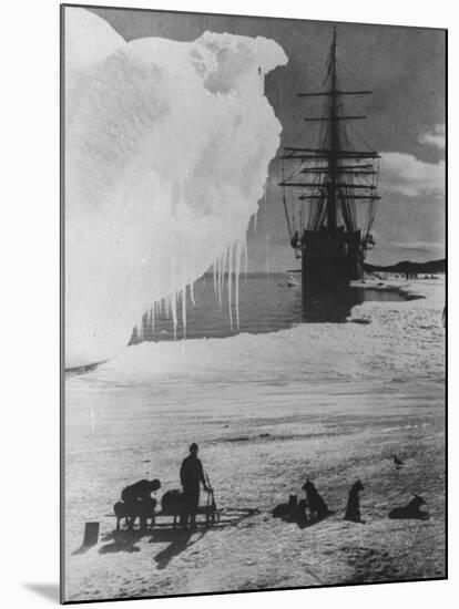 Antarctic Expedition of Robert Scott on Ice with Ship "Terra Nova" Anchored in Background-null-Mounted Photographic Print