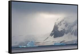 Antarctica. Bransfield Strait. Iceberg under Stormy Skies-Inger Hogstrom-Framed Stretched Canvas