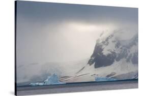 Antarctica. Bransfield Strait. Iceberg under Stormy Skies-Inger Hogstrom-Stretched Canvas