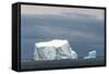 Antarctica. Bransfield Strait. Iceberg under Stormy Skies-Inger Hogstrom-Framed Stretched Canvas