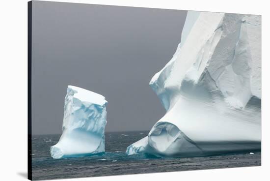 Antarctica. Bransfield Strait. Iceberg under Stormy Skies-Inger Hogstrom-Stretched Canvas