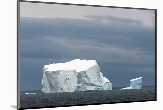 Antarctica. Bransfield Strait. Iceberg under Stormy Skies-Inger Hogstrom-Mounted Photographic Print