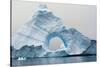 Antarctica. Charlotte Bay. Giant Iceberg with a Hole-Inger Hogstrom-Stretched Canvas