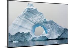 Antarctica. Charlotte Bay. Giant Iceberg with a Hole-Inger Hogstrom-Mounted Photographic Print