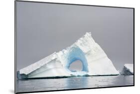 Antarctica. Charlotte Bay. Giant Iceberg with a Hole-Inger Hogstrom-Mounted Photographic Print