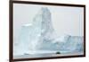 Antarctica. Charlotte Bay. Zodiac Dwarfed by a Giant Towering Iceberg-Inger Hogstrom-Framed Photographic Print