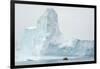 Antarctica. Charlotte Bay. Zodiac Dwarfed by a Giant Towering Iceberg-Inger Hogstrom-Framed Photographic Print