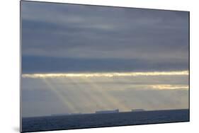 Antarctica. Crepuscular Rays Shining Down onto Tabular Icebergs-Inger Hogstrom-Mounted Photographic Print