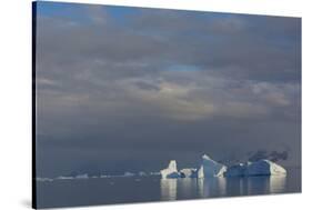 Antarctica. Gerlache Strait. Iceberg and Cloudy Skies-Inger Hogstrom-Stretched Canvas