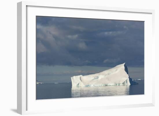 Antarctica. Gerlache Strait. Iceberg and Cloudy Skies-Inger Hogstrom-Framed Photographic Print