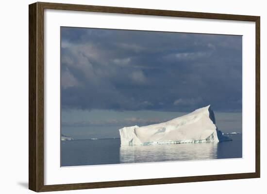 Antarctica. Gerlache Strait. Iceberg and Cloudy Skies-Inger Hogstrom-Framed Photographic Print