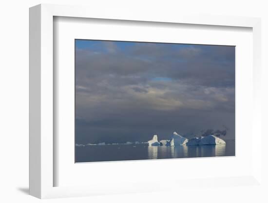 Antarctica. Gerlache Strait. Iceberg and Cloudy Skies-Inger Hogstrom-Framed Photographic Print