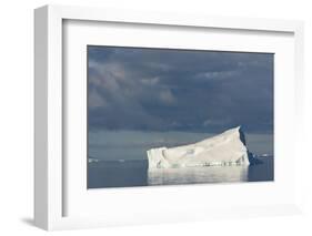 Antarctica. Gerlache Strait. Iceberg and Cloudy Skies-Inger Hogstrom-Framed Photographic Print