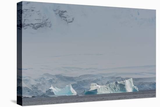 Antarctica. Gerlache Strait. Iceberg with Glacier in the Background-Inger Hogstrom-Stretched Canvas