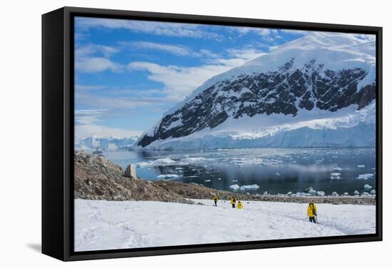 Antarctica. Neko Harbor. Hikers Heading Towards the Penguin Colony-Inger Hogstrom-Framed Stretched Canvas