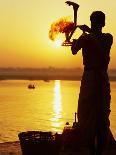 Priest Moves Lantern in Front of Sun During Morning Puja on Ganga Ma, Varanasi, India-Anthony Plummer-Stretched Canvas
