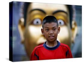 Anti-Government Protester Listens to Speeches in a Main Commercial Shopping District in Bangkok-null-Stretched Canvas