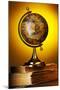 Antique Globe on Old Books over Yellow-haveseen-Mounted Photographic Print