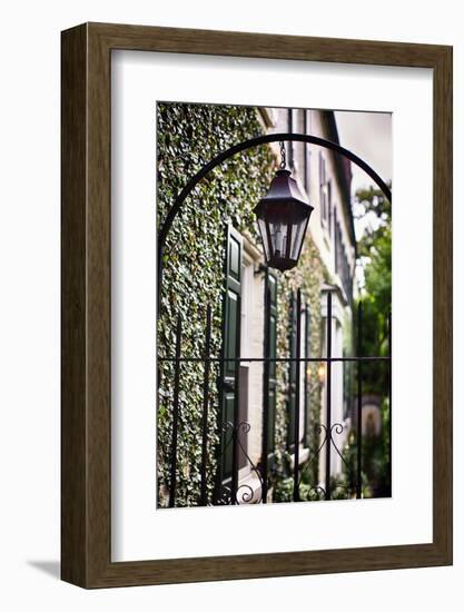 Antique Lamp On A Fence-George Oze-Framed Photographic Print