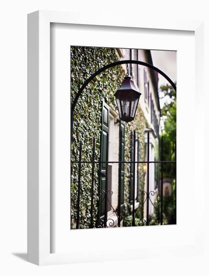 Antique Lamp On A Fence-George Oze-Framed Photographic Print