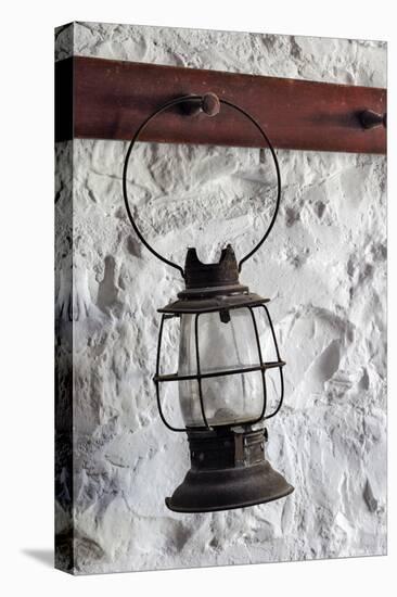 Antique lantern hanging on white wall, Shaker Village of Pleasant Hill, Harrodsburg, Kentucky-Adam Jones-Stretched Canvas