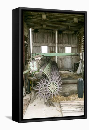 Antique Plow in an Old Wooden Barn, Joliet, Illinois, USA. Route 66-Julien McRoberts-Framed Stretched Canvas