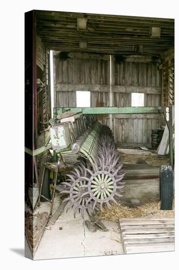 Antique Plow in an Old Wooden Barn, Joliet, Illinois, USA. Route 66-Julien McRoberts-Stretched Canvas