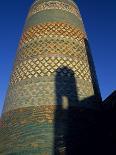 Minaret and Tiled Dome of a Mosque Rise Above the Old City of Khiva-Antonia Tozer-Photographic Print