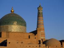 Minaret and Tiled Dome of a Mosque Rise Above the Old City of Khiva-Antonia Tozer-Photographic Print