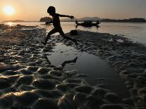 A Boy Plays on the Banks of the River Brahmaputra in Gauhati, India, Friday, October 27, 2006-Anupam Nath-Framed Stretched Canvas