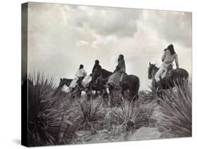 Apache on Horseback, c1906-Edward S. Curtis-Stretched Canvas