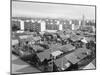 Apartment Buildings and Wooden Shacks-null-Mounted Photographic Print