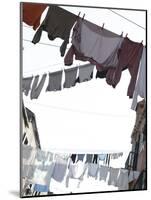 Apartment Buildings with Laundry Hanging Out to Dry on Clothes Line-null-Mounted Photographic Print