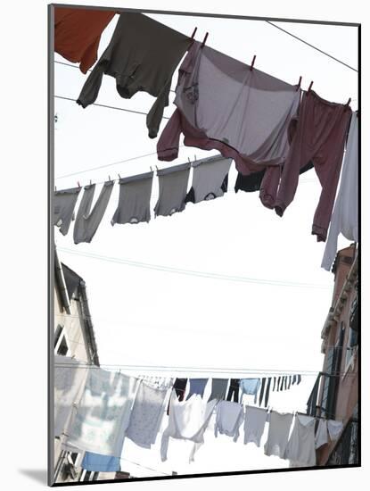 Apartment Buildings with Laundry Hanging Out to Dry on Clothes Line-null-Mounted Photographic Print