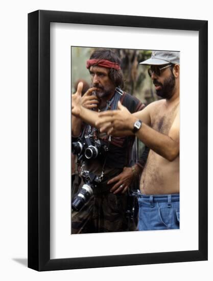 APOCALYPSE NOW, 1979 directed by FRANCIS FORD COPPOLA On the set, Francis Ford Coppola directs Denn-null-Framed Photo