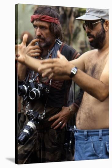 APOCALYPSE NOW, 1979 directed by FRANCIS FORD COPPOLA On the set, Francis Ford Coppola directs Denn-null-Stretched Canvas