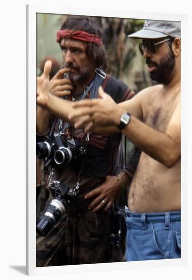 APOCALYPSE NOW, 1979 directed by FRANCIS FORD COPPOLA On the set, Francis Ford Coppola directs Denn-null-Framed Photo