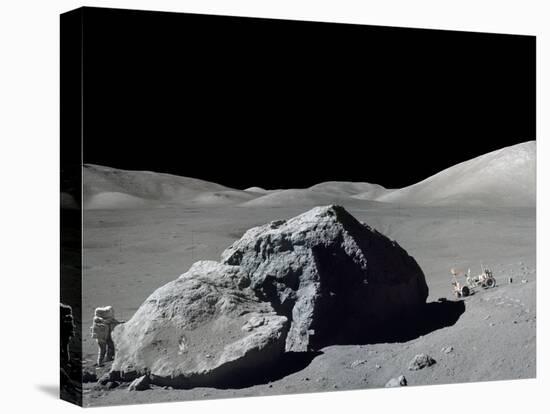 Apollo 17 Geologist-Astronaut Harrison Schmitt Standing Next to a Huge, Split Lunar Boulder-null-Stretched Canvas