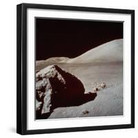 Apollo 17's Rover, a Lunar Vehicle, on the Surface of the Moon Next to Giant Rock-null-Framed Photographic Print